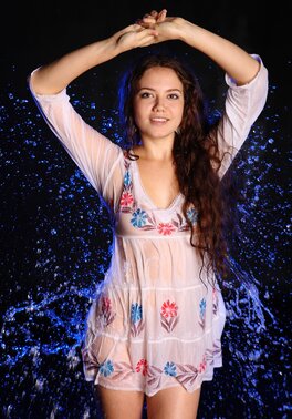 Joyful Euro sexpot covered in water while posing completely naked