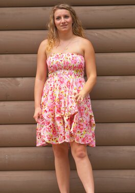 Beauty with wavy hair flashes her natural tits and lovely ass outdoors