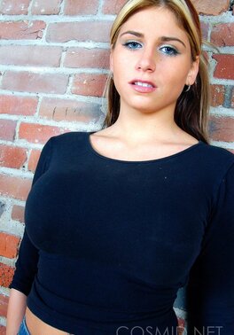 Sultry towheaded gal slowly strips to black lingerie to reveal her perfect curves