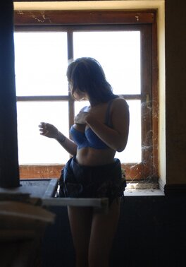 Playful bimbo agrees to reveal her perky assets in the abandoned café