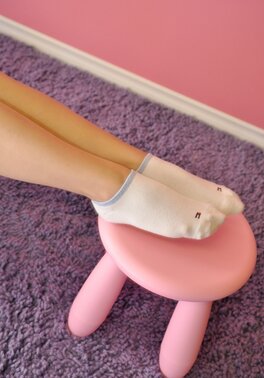 Kinky teen with twin tails removes T-shirt to erotically model in thong panties