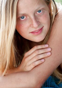 Blondie with long legs and firm ass is going to tease outside