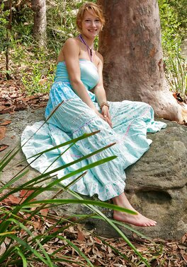 Redheaded adventurer showing her firm ass in the woods too