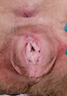 Busty whore fondles her tits to spread her pussy lips later