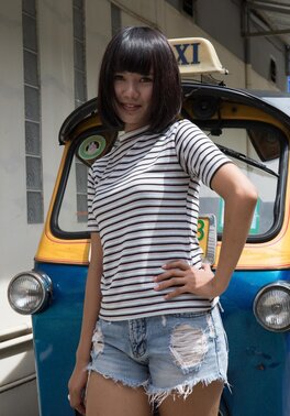 Lovely teen with a bob haircut strips to show her tight ass