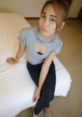 Young Thai babe shows her natural boobs and pretty face