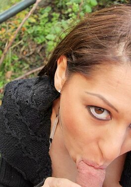 A strong, capable brunette is capable of sucking dick outside