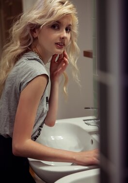 Angelik peels off her clothes to spread naked at her desk