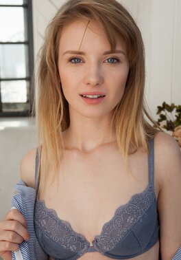 She removes underwear to expose her hot teen ass in the window