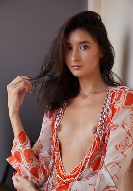 Solo model Bambi Joli enjoys posing naked after stripping