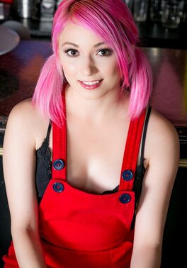 Petite teen with dyed hair is posing naked after work is over