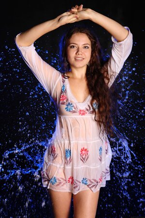 Joyful Euro sexpot covered in water while posing completely naked