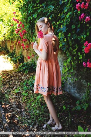 Attractive teen with skinny legs likes to show her body in the garden