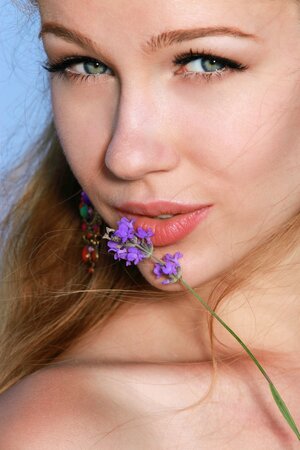 Enticing beauty finds spacious field ideal for nude relax under sun