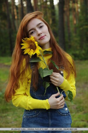 Ginger with red hair on the head and pubis undresses at the picnic