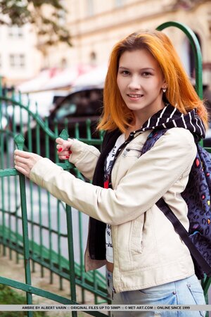 Long-legged young redhead breathes fresh air and enters home to pose naked