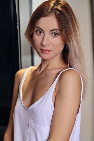 Lassie decides to remove top and pants and pose on the high chair in the kitchen