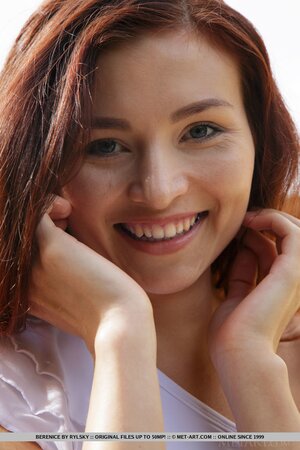 Redhead with no breasts comes out and gets rid of white dress under the sun