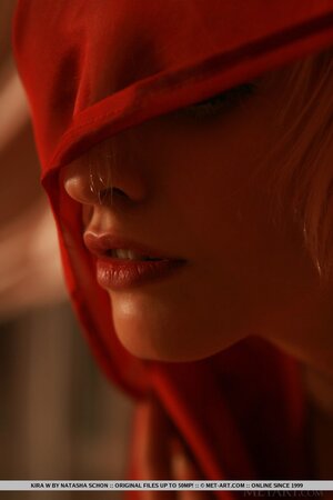 Gorgeous blonde teen Kira W slips out of red lingerie to model in the nude