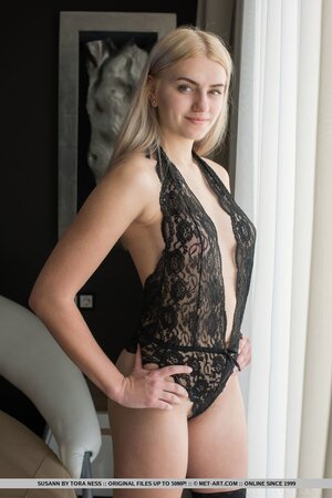 Blonde model took off black lingerie and high heels showing tits and hairy pussy