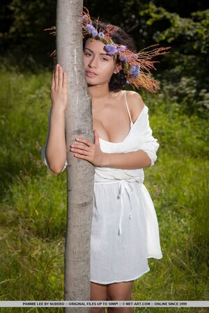 Tender chick felt free for the first time hugging a tree in the nude