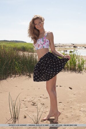 Lakeside becomes a place where nice girl with beautiful smile poses naked