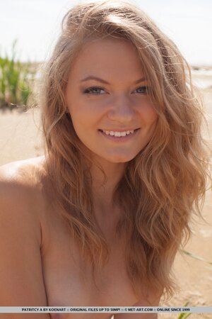 Lakeside becomes a place where nice girl with beautiful smile poses naked