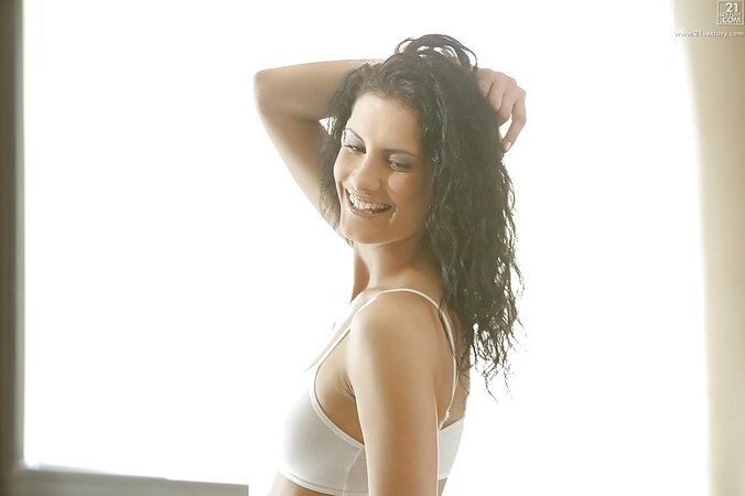 In the bedroom with gorgeous brunette model Leanna Sweet getting nude