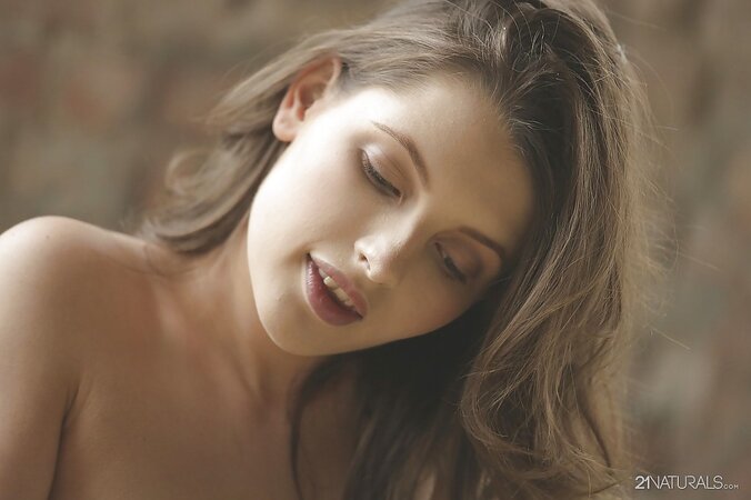 Teen Lil Tammy pulls shorts down and quickly bares her shaved pussy to finger it