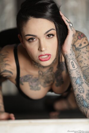 Inked hottie is alone at home and can freely show on camera her assets