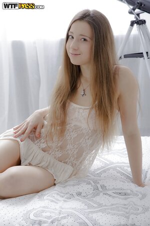 Bashful teen Inez Steffan takes off nightie and lingerie in the bedroom photoset