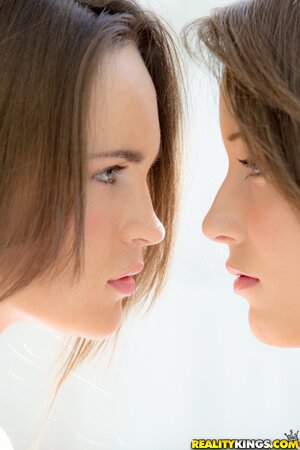 Nude girlfriends finally come on balcony to share passionate kisses