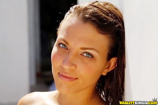 Enjoyable sweetheart relaxes under sun with her perky tits exposed