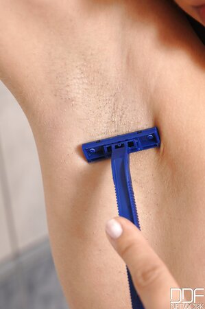 Female with red hair shaved her cherry without taking black stockings off