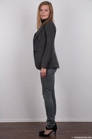 Cute chick takes official outfit down to be close to fans in the nude