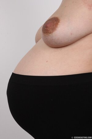 Pregnant temptress with hairy pussy doesn't know how to keep belly under outfit