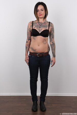Diva with bright lipstick and tattoos all over her body exposes shaved snatch