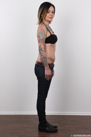 Diva with bright lipstick and tattoos all over her body exposes shaved snatch