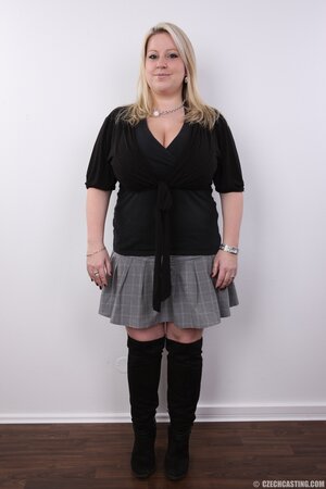 Blonde cutie manages to look sexy without concealing super colossal breasts