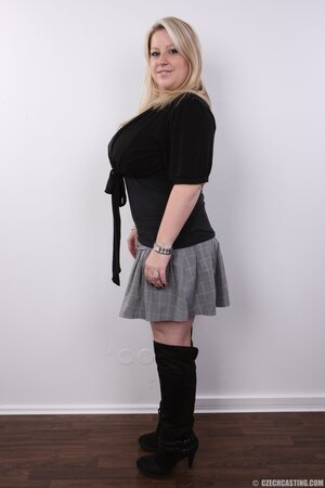 Blonde cutie manages to look sexy without concealing super colossal breasts