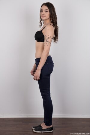 Small-tittied tattooed chick wants to boast about her tattoo sleeve in the studio