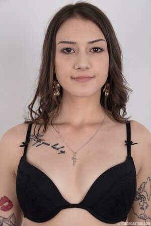 Small-tittied tattooed chick wants to boast about her tattoo sleeve in the studio