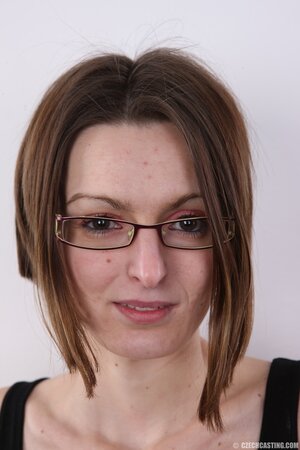 Slender MILF with glasses shows perky tits and sweet vagina at casting