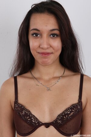 Czech whore Rita Sinclair gets naked and sits on a stool taking obscene pose