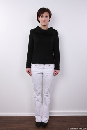 Housewife takes clothes off freeing small breasts and manifesting smooth cunt