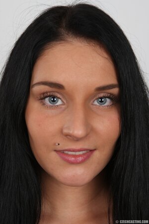 Brunette chick with pierced upper lip and tattooed belly remains naked