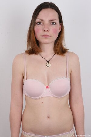 Young woman was hired as a porn model and posed naked in an empty room