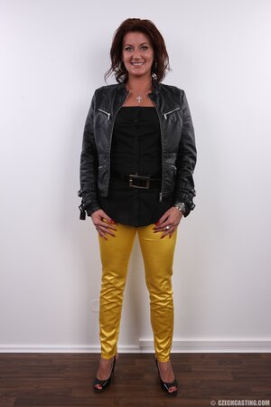 Hot MILF takes yellow pants and leather jacket off continuing with her underwear