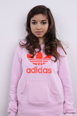 Model takes sweatshirt and striped tunic off continuing with bra and panties