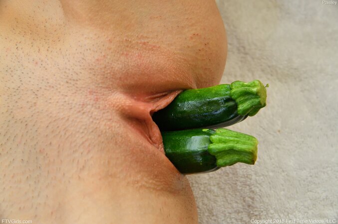 Steamy cutie puts several zucchini in slit simultaneously stretching it
